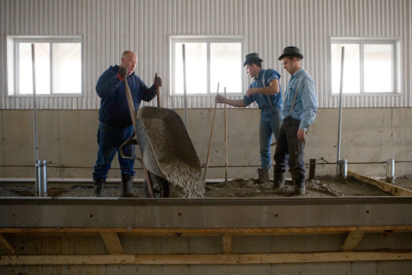 Nelson Pouring the Concrete Floor in the New Milking Parlor