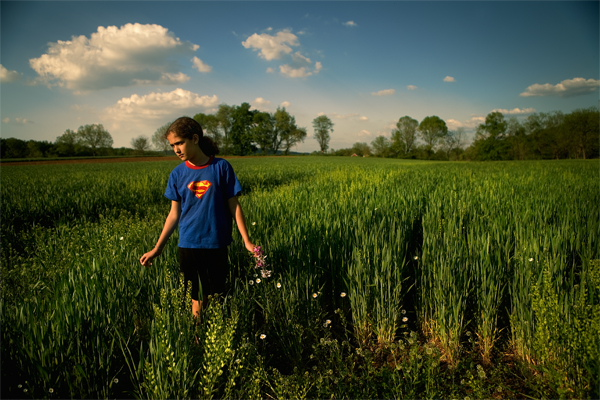 Super Girl with Ox-Eye Daisies (<i>Chrysanthemum leucanthemum</i>)